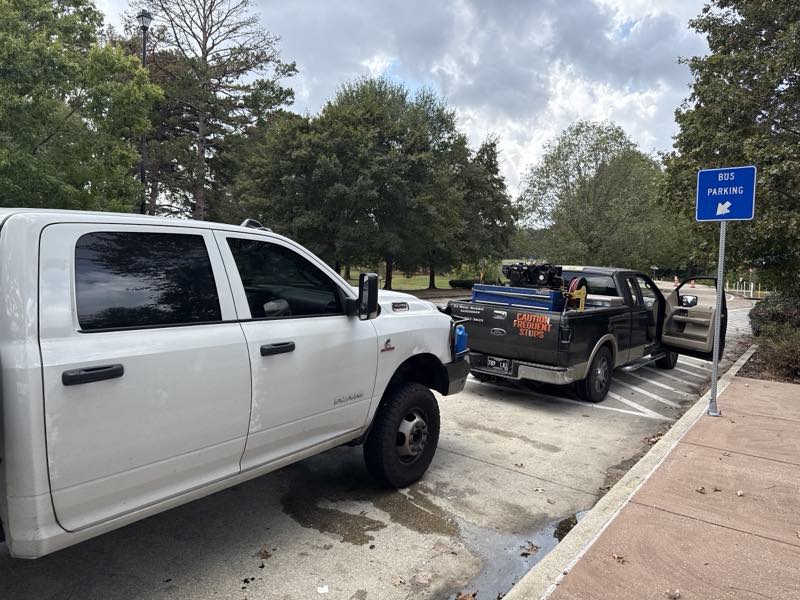24-hour roadside assistance service truck next to a diesel pickup